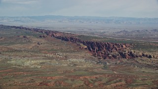 AX139_003E - 5.5K aerial stock footage of passing by Devil's Garden in Arches National Park, Utah