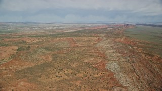 AX139_005 - 5.5K aerial stock footage of flying over open desert in Arches National Park, Utah