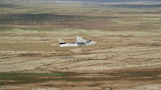 AX139_057E - 5.5K aerial stock footage of flying beside a Tecnam P2006T and Cessna flying over desert, Grand County, Utah