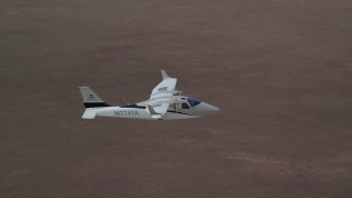 AX139_066 - 5.5K aerial stock footage of Tecnam P2006T airplane flying over desert, Grand County, Utah