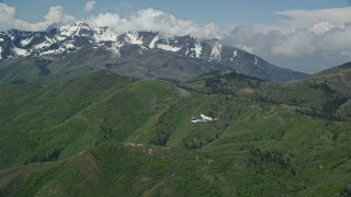 AX140_113E - 5.5K aerial stock footage of a view of a Tecnam P2006T near Coral Mountain, Wasatch Range, Utah