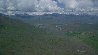 AX140_155 - 5.5K aerial stock footage of approaching reservoir and green mountains, Deer Creek Reservoir, Utah