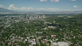 AX140_250E - 5.5K aerial stock footage of approaching Downtown Salt Lake City and Utah State Capitol