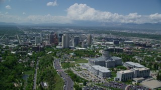 AX140_255 - 5.5K stock footage aerial video orbit Utah State Capitol with view of Downtown Salt Lake City, Utah