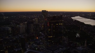 AX141_028 - 5.5K aerial stock footage flying by Millennium Tower, Downtown Boston, Back Bay, Massachusetts, twilight