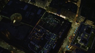 AX141_054E - 5.5K aerial stock footage of a bird's eye view over skyscrapers, city streets, Downtown Boston, Massachusetts, night