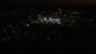 AX141_084E - 5.5K aerial stock footage flying by baseball game in progress at Fenway Park, Boston, Massachusetts, night