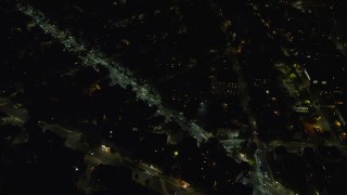 AX141_086E - 5.5K aerial stock footage of a bird's eye view flying over office buildings, Cambridge, Massachusetts, night