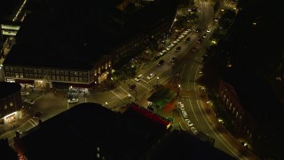 AX141_091 - 5.5K aerial stock footage of a bird's eye view over Harvard Square, intersection, Harvard University, Massachusetts, night