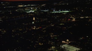 AX141_100 - 5.5K aerial stock footage flying by the campus of Harvard University, Massachusetts, night