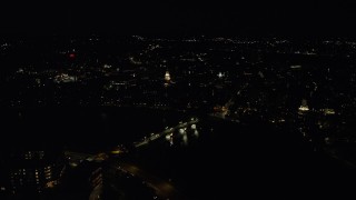 AX141_118 - 5.5K aerial stock footage flying by Lowell House, John W. Weeks Bridge, Harvard University, Massachusetts, night