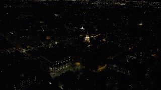 AX141_121 - 5.5K stock footage aerial video orbiting Lowell House and Adams House, Harvard University, Massachusetts, night