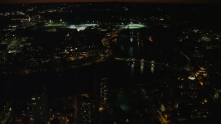 AX141_126 - 5.5K aerial stock footage of John W. Weeks Bridge and Anderson Memorial Bridge, Harvard University, Massachusetts, night