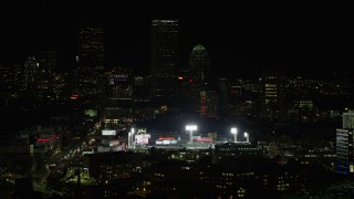 AX141_142 - 5.5K aerial stock footage flying by lights of Fenway Park, Downtown Boston, Massachusetts, night