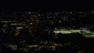 AX141_145 - 5.5K aerial stock footage of Massachusetts Institute of Technology, sports fields, Cambridge, Massachusetts, night