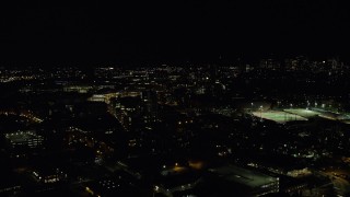 AX141_147 - 5.5K aerial stock footage flying by Massachusetts Institute of Technology, office buildings, Cambridge, Massachusetts, night