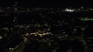 AX141_153 - 5.5K aerial stock footage flying by MIT, Massachusetts Institute of Technology, Cambridge, Massachusetts, night