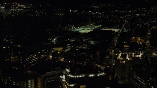 AX141_154 - 5.5K aerial stock footage flying by Massachusetts Institute of Technology, Cambridge, Massachusetts, night