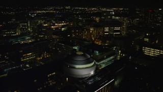 AX141_162E - 5.5K aerial stock footage approaching and flying over Massachusetts Institute of Technology, Cambridge, Massachusetts, night
