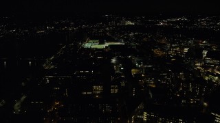 AX141_168 - 5.5K aerial stock footage approaching Maclaurin Building, sports fields, Massachusetts Institute of Technology, Cambridge, Massachusetts, night