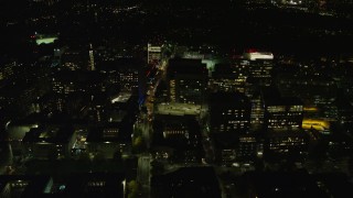 AX141_177E - 5.5K aerial stock footage orbiting Longwood Medical Area, city lights, Boston, Massachusetts, night