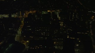 AX141_197 - 5.5K aerial stock footage orbiting city streets, Massachusetts, General Hospital, West End, Downtown Boston, Massachusetts, night
