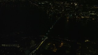 AX141_198 - 5.5K aerial stock footage approaching Longfellow Bridge and tilt down, Boston, Massachusetts, night