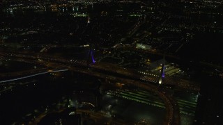 AX141_201 - 5.5K aerial stock footage flying by the Zakim Bridge, Boston, Massachusetts, night