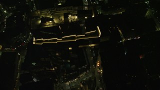 AX141_216E - 5.5K aerial stock footage flying by the Millennium Tower, Downtown Boston, Massachusetts, night