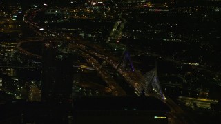 AX141_241 - 5.5K aerial stock footage flying by the Zakim Bridge, Boston, Massachusetts, night