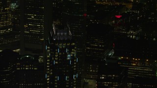 AX141_242 - 5.5K aerial stock footage flying by One Boston Place, Downtown Boston, Massachusetts, night