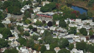 AX142_008 - 5.5K aerial stock footage flying by small town, trees, small pond, autumn, Hyde Park, Massachusetts
