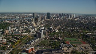 AX142_016E - 5.5K aerial stock footage flying over Roxbury in autumn, approaching Downtown Boston, Massachusetts
