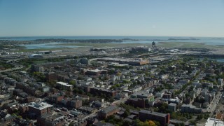 AX142_027 - 5.5K aerial stock footage approaching, flying over Logan International Airport, East Boston, Massachusetts