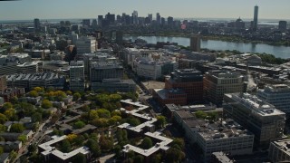 AX142_046E - 5.5K aerial stock footage flying by MIT, revealing Downtown Boston skyline, Cambridge, Massachusetts