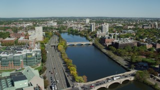 AX142_078 - 5.5K aerial stock footage flying over Charles River, approaching bridges, Cambridge, Massachusetts