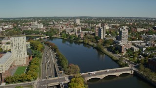 AX142_078E - 5.5K aerial stock footage flying over Charles River, approaching bridges, Cambridge, Massachusetts