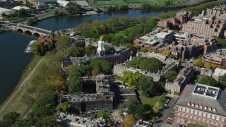 AX142_100 - 5.5K stock footage aerial video orbiting Harvard University and Eliot House, Cambridge, Massachusetts