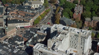 AX142_109 - 5.5K aerial stock footage orbiting Harvard University, Harvard Square, Cambridge, Massachusetts