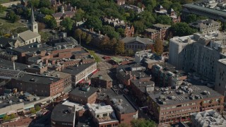 AX142_110E - 5.5K aerial stock footage orbiting Harvard University, Harvard Square, Cambridge, Massachusetts