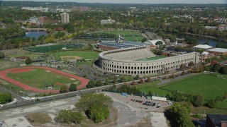 AX142_117 - 5.5K aerial stock footage of Harvard Stadium, Harvard University, McCurdy Track,  Cambridge, Massachusetts