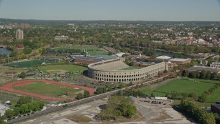 AX142_117E - 5.5K aerial stock footage of Harvard Stadium, Harvard University, McCurdy Track,  Cambridge, Massachusetts