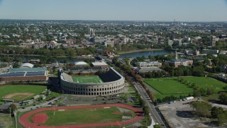 AX142_119 - 5.5K stock footage aerial video approaching Harvard Stadium, Harvard University, Cambridge, Massachusetts