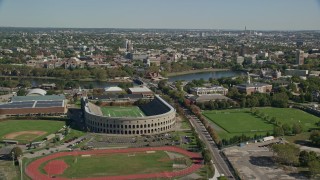 AX142_119E - 5.5K aerial stock footage approaching Harvard Stadium, Harvard University, Cambridge, Massachusetts