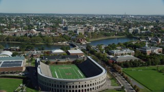 AX142_120 - 5.5K stock footage aerial video flying over Harvard Stadium, approach Harvard University, Cambridge, Massachusetts