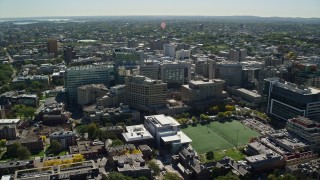 AX142_129E - 5.5K aerial stock footage approaching and flying by the Longwood Medical Area, Boston, Massachusetts
