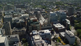 AX142_137E - 5.5K aerial stock footage flying by Longwood Medical Area, approaching power plant, Boston, Massachusetts