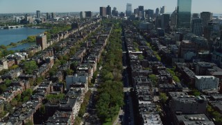 AX142_163 - 5.5K stock footage aerial video flying over Victorian brownstones, Back Bay, Downtown Boston, Massachusetts