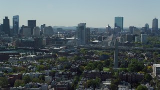 AX142_180 - 5.5K stock footage aerial video of Bunker Hill Monument, Downtown Boston skyline, Charlestown, Massachusetts