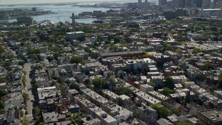 AX142_182 - 5.5K aerial stock footage flying by Bunker Hill Monument, row houses, Charlestown, Massachusetts